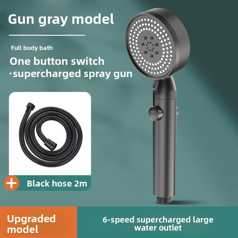 Handheld shower with black hose on a green background
